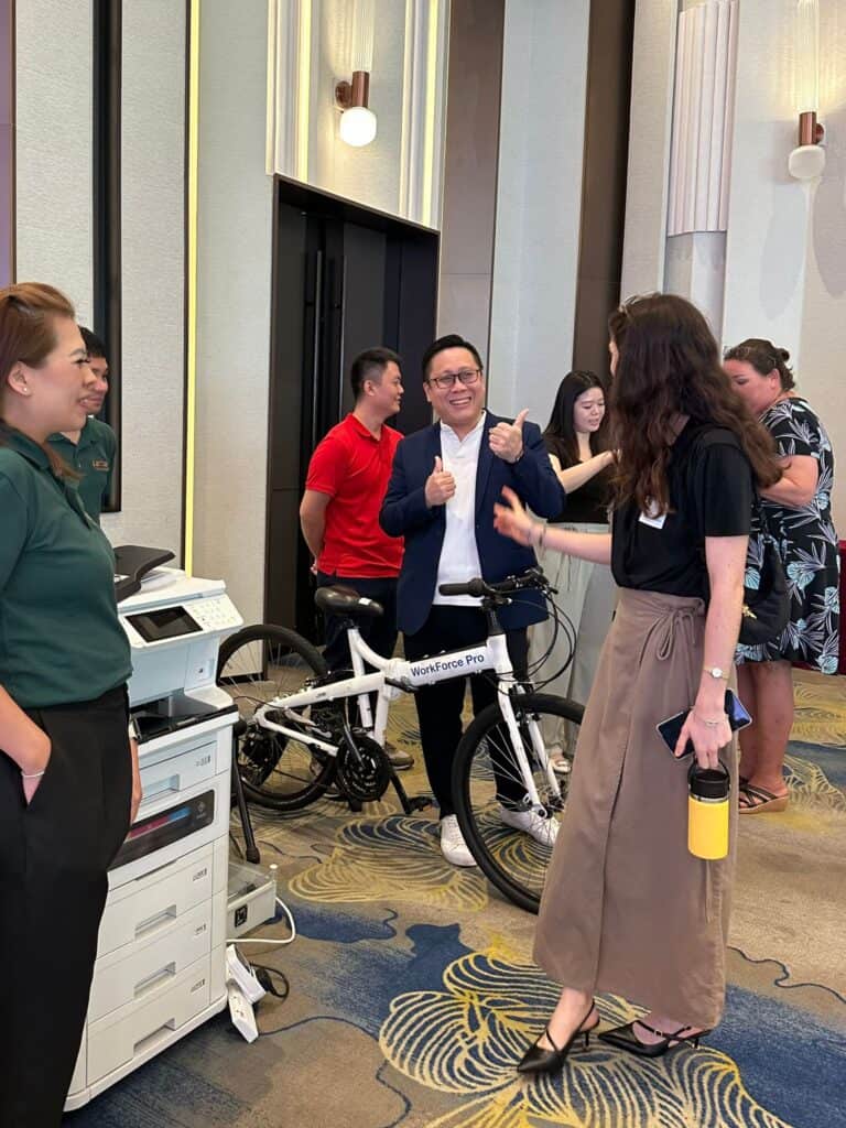 Estes Consultancy booth highlighting ESG reporting, sustainable solutions, and green consulting in Singapore